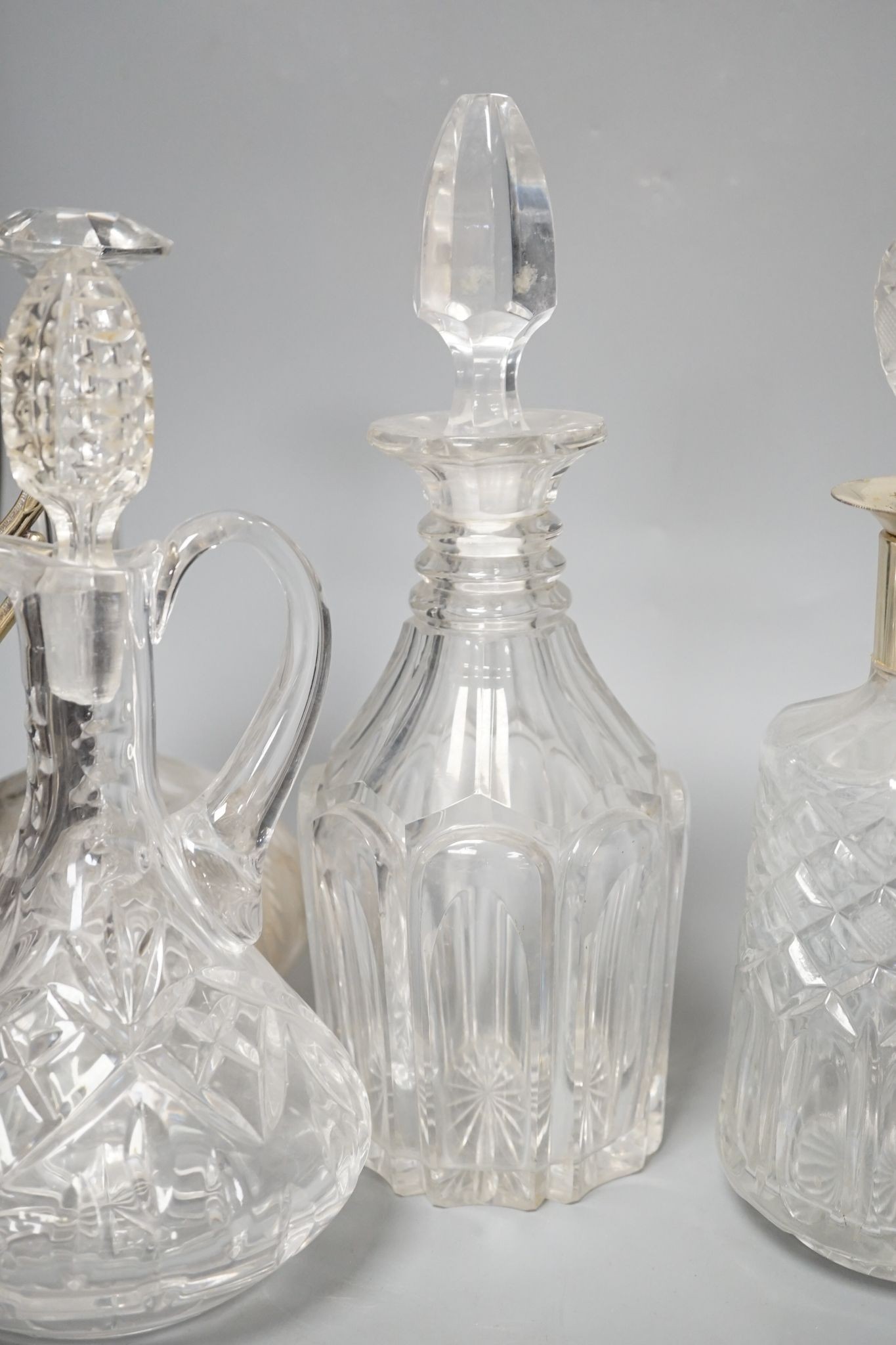 A Hukin and Heath claret jug and other decanters etc.